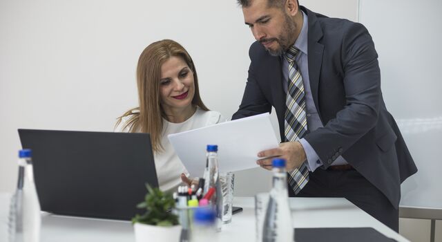 COLOUR-IMAGE_man-and-woman-reviewing-documents_jul26