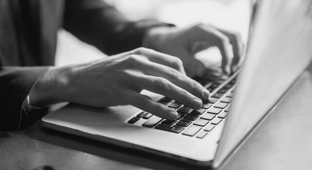 SINGLE-IMAGE_close-up-of-a-hands-of-a-businessman-on-a-keyboard_jul25