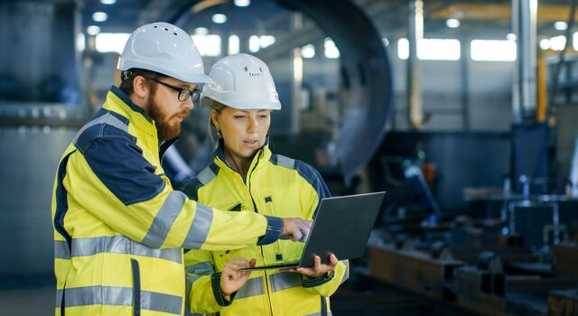COLOUR-IMAGE_Male_Female_Industrial_Engineers_laptop_july26