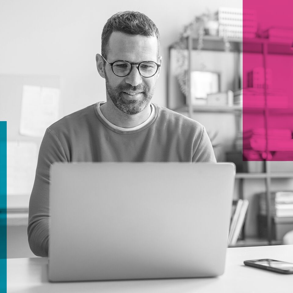 SINGLE-IMAGE_squares-sitting-at-his-desk-and-using-laptop_may25