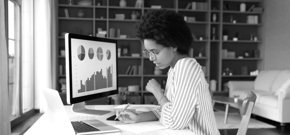 SINGLE-IMAGE_concentrated-young-african-american-woman-working-desktop_may24