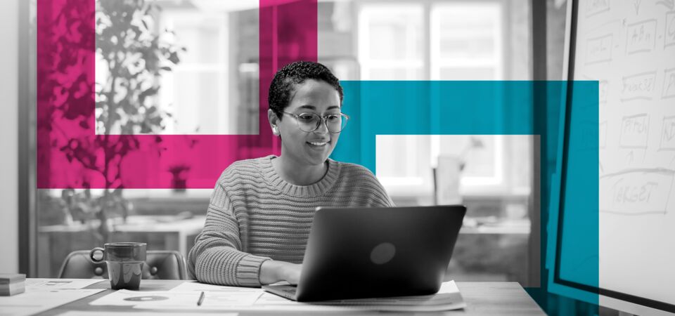 SINGLE-IMAGE_squares-woman-smiling-at-desk-with-laptop_sept23