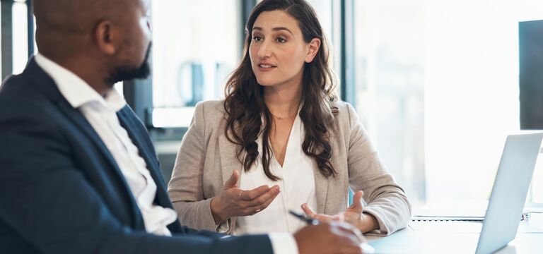 /bynder-asset/bynder:27A4C357-FFBB-4EC4-924349243B2AE50F/Landscape_MD/COLOUR-IMAGE_man-and-woman-having-a-meeting-with-laptop-on-desk_jul26.jpg?1782917092000