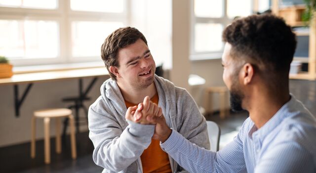 COLOUR-IMAGE_NDIS-two-people-handshake