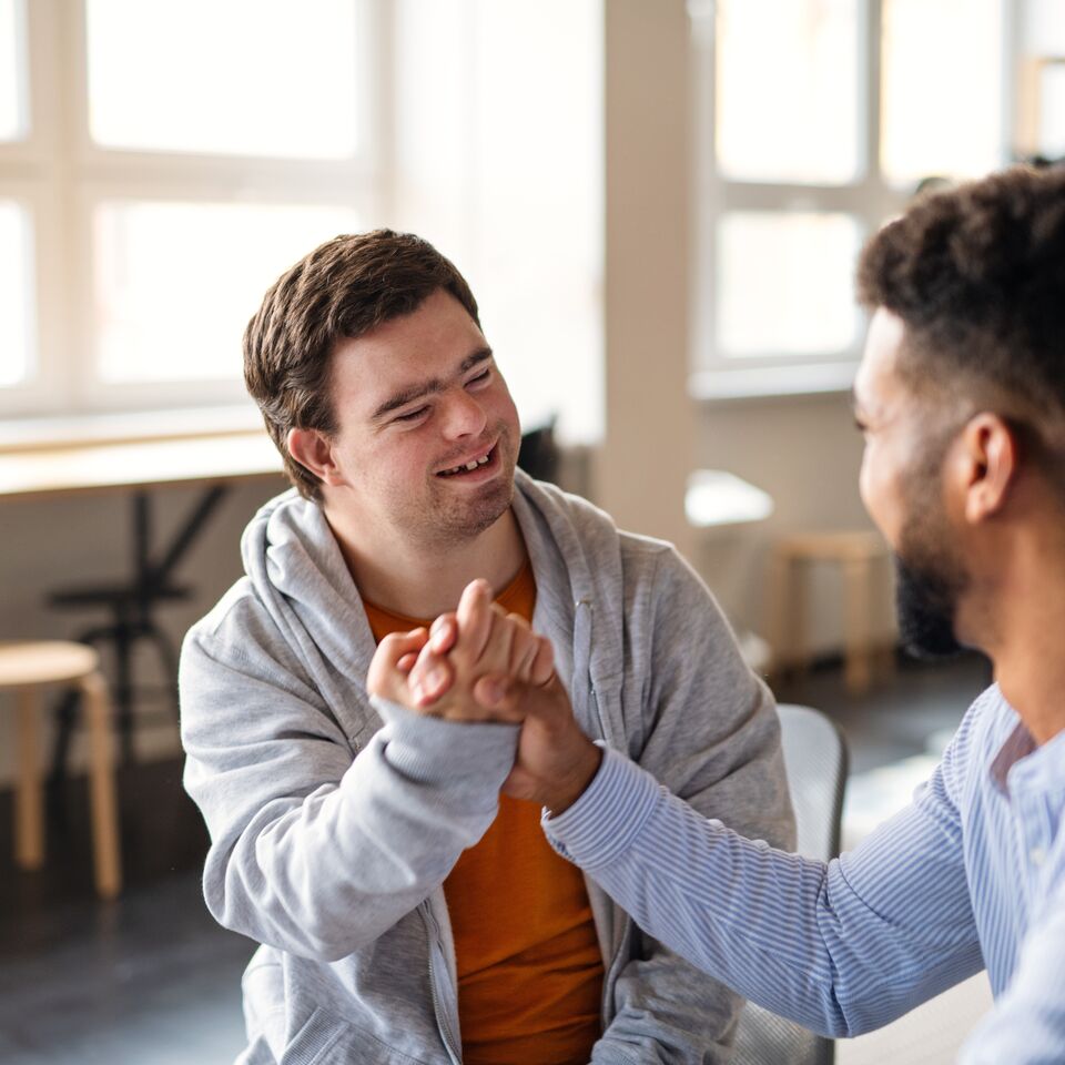 COLOUR-IMAGE_NDIS-two-people-handshake