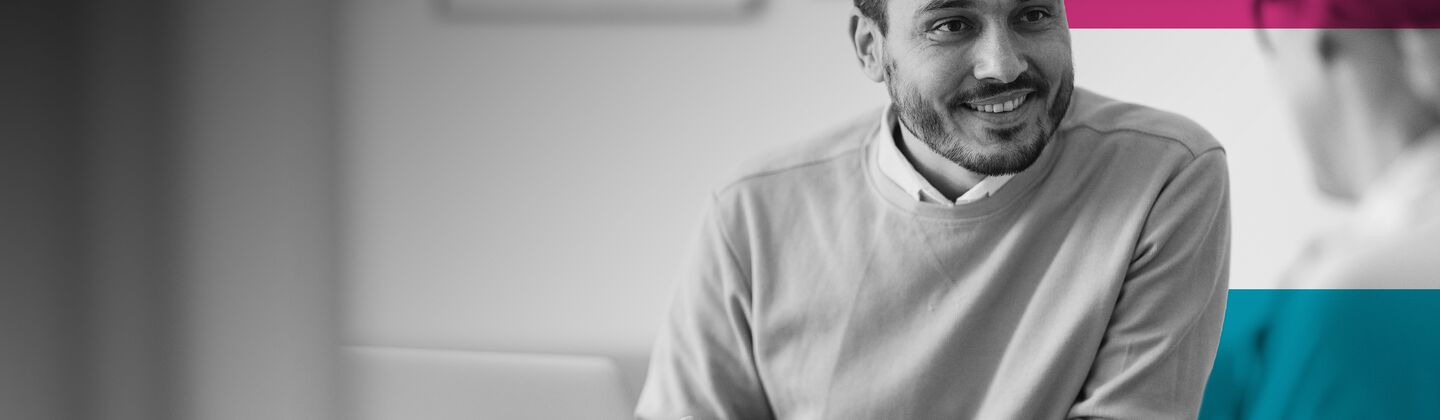 SINGLE-IMAGE_man-talking-to-colleague-with-squares_apr24