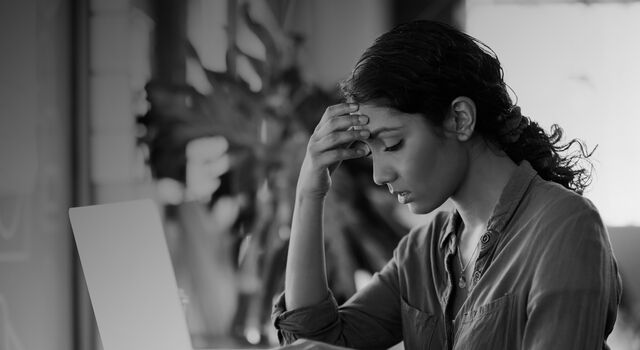 SINGLE-IMAGE_stressed-woman-at-laptop_apr24