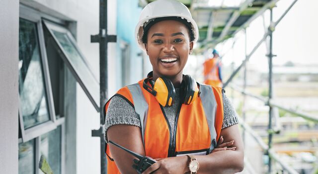 COLOUR-IMAGE_woman-construction-smiling_JUL26