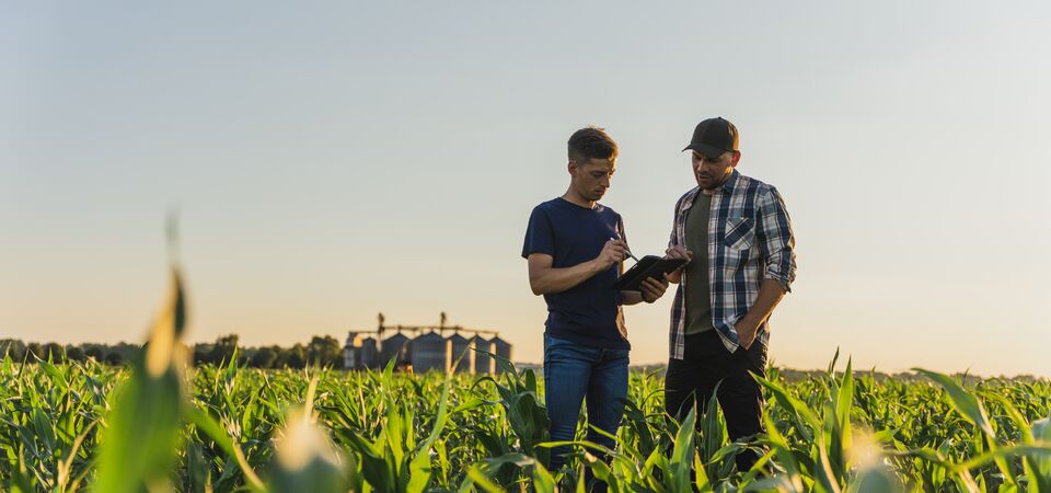 COLOUR-IMAGE_two-farmers-in-field_feb26