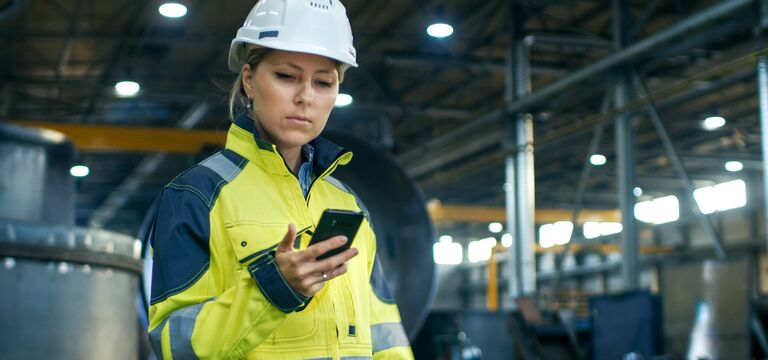 /bynder-asset/bynder:58E6D927-9DF1-49C8-BD69CCA8AD6FD201/Landscape_MD/COLOUR-IMAGE_female-worker-in-hi-vis-looking-at-mobile-phone_jul26.jpg?1784550909000
