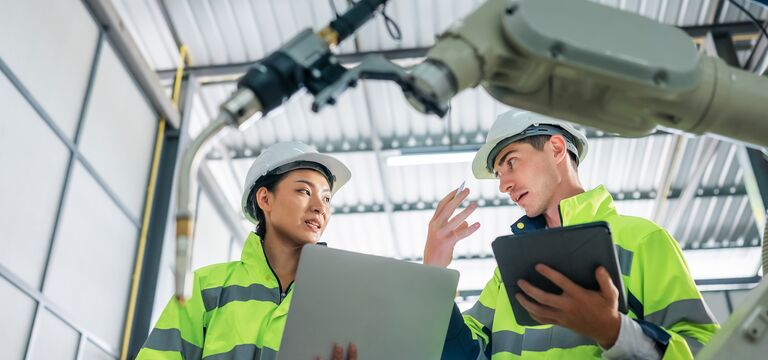 /bynder-asset/bynder:5A9148D6-19B7-4B95-BDFC781D5907F3D5/Landscape_MD/COLOUR-IMAGE_two-workers-wearing-hi-vis-coats-holding-devices_apr26.jpg?1776243913000