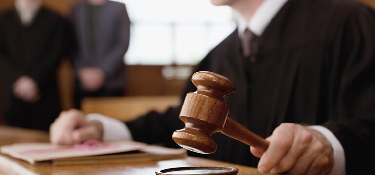 /bynder-asset/bynder:70124321-3FAD-4458-BADC84C8FC0F39B1/Landscape_MD/COLOUR-IMAGE_male-judge-holding-gavel_feb26.jpg?1773752970000