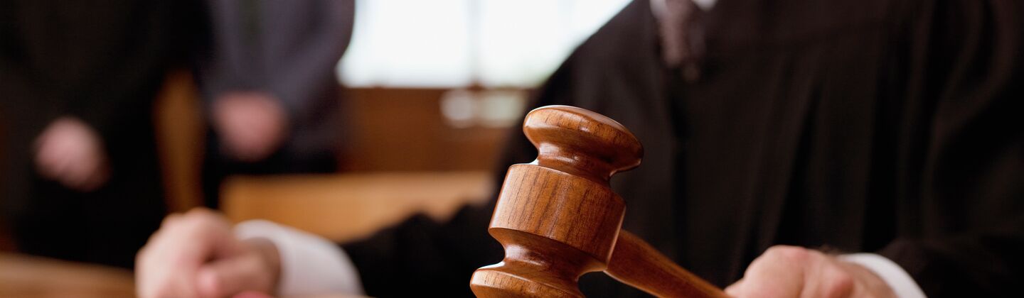 COLOUR-IMAGE_male-judge-holding-gavel_feb26