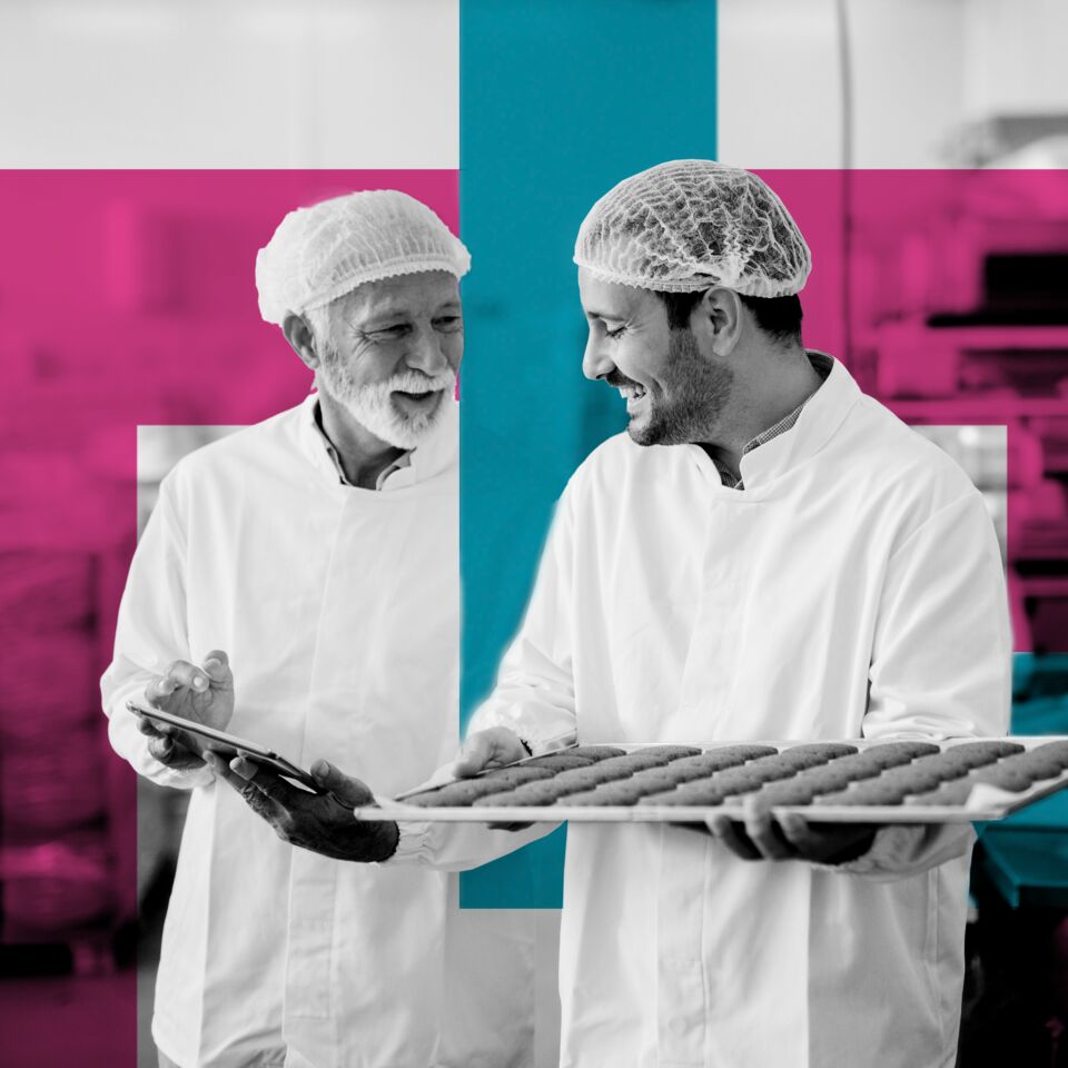 SINGLE-IMAGE_squares-man-with-tablet-checking-tray-of-biscuits_nov23