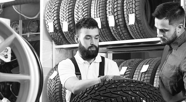 SINGLE-IMAGE_two-people-are-inspecting-the-tires_may24