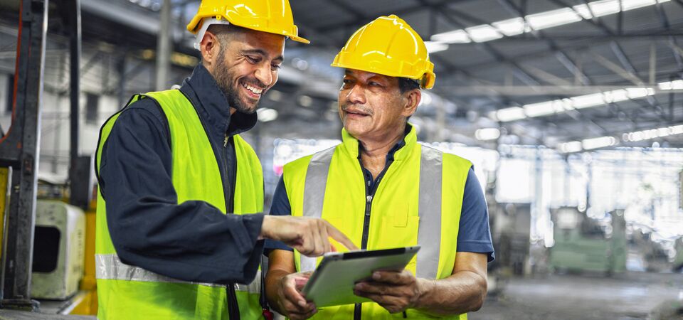 COLOUR-IMAGE_Male-two-engineer-tablet-factory_july26