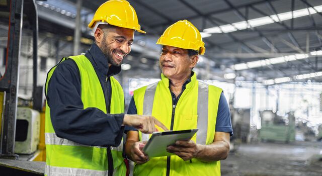 COLOUR-IMAGE_Male-two-engineer-tablet-factory_july26