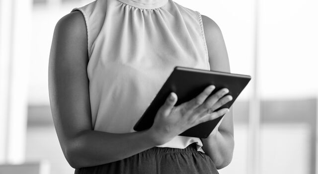 SINGLE-IMAGE_black-woman-smiling-with-tablet_aug24