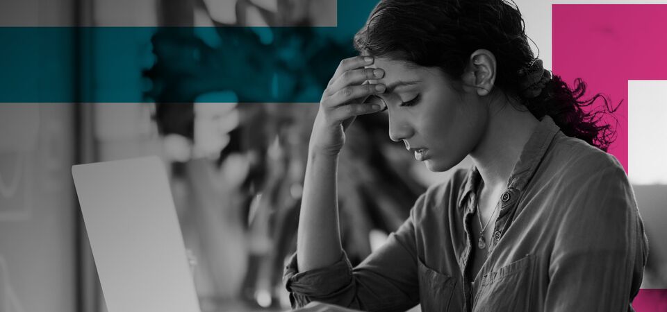 SINGLE-IMAGE_stressed-woman-at-laptop-with-squares_apr24