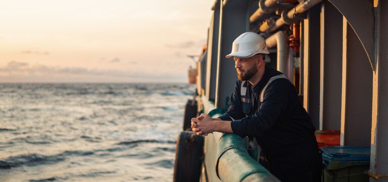 /bynder-asset/bynder:93D25495-62E2-4B38-88B6778945CC0445/Landscape_MD/COLOUR-IMAGE_maritime-worker-on-boat-looking-to-sea_mar26.jpg?1773752992000