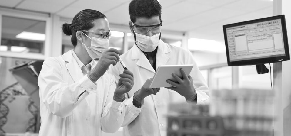 SINGLE-IMAGE_discussing-over-digital-tablet-at-laboratory_mar25