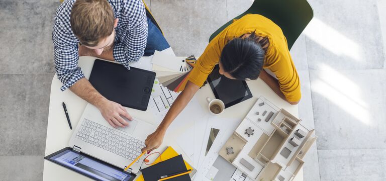 /bynder-asset/bynder:977D5F26-68F7-4716-9BB3A0178BCEDD72/Landscape_MD/COLOUR-IMAGE_Man-woman-architects-working-project_july26.jpg?1782911750000