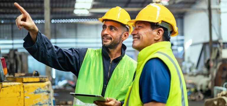 /bynder-asset/bynder:A1F9F5D2-789F-4C32-8B3A4B44A3E31A3C/Landscape_MD/COLOUR-IMAGE_two-men-looking-at-fixture-in-factory_apr26.jpg?1776243913000