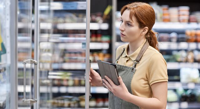 COLOUR-IMAGE_woman-checking-supermarket-shelves_feb26