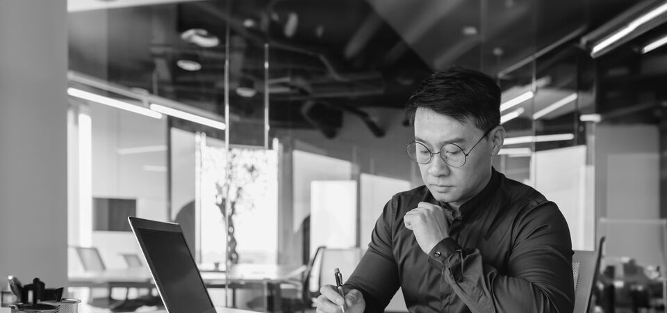 SINGLE-IMAGE_man-paperwork-black-and-white_feb24