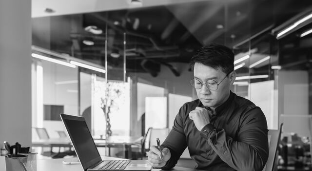 SINGLE-IMAGE_man-paperwork-black-and-white_feb24