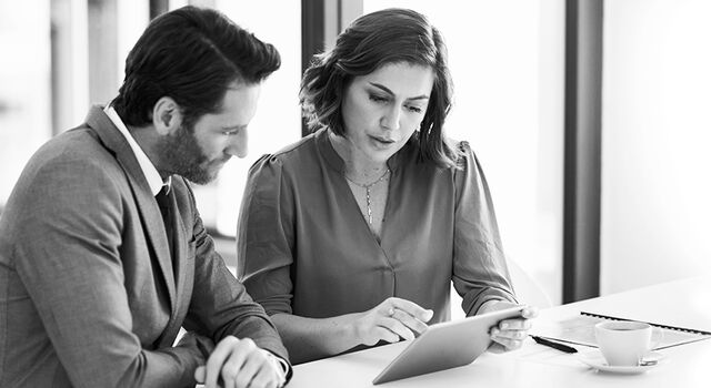 SINGLE-IMAGE_business-people-with-tablet_may25