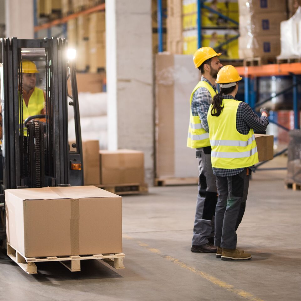 COLOUR-IMAGE-forklift-driving-near-workers-in-warehouse_jun26