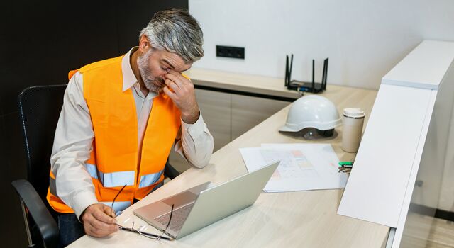COLOUR-IMAGE_Man-headache-laptop-architect_july26