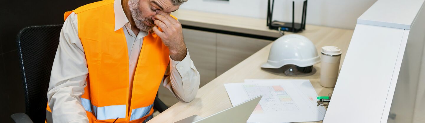 COLOUR-IMAGE_Man-headache-laptop-architect_july26