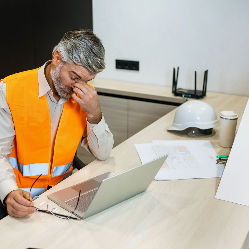 COLOUR-IMAGE_Man-headache-laptop-architect_july26
