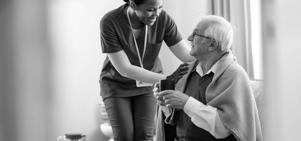 SINGLE-IMAGE_sitting-elderly-man-with-nurse_aug25