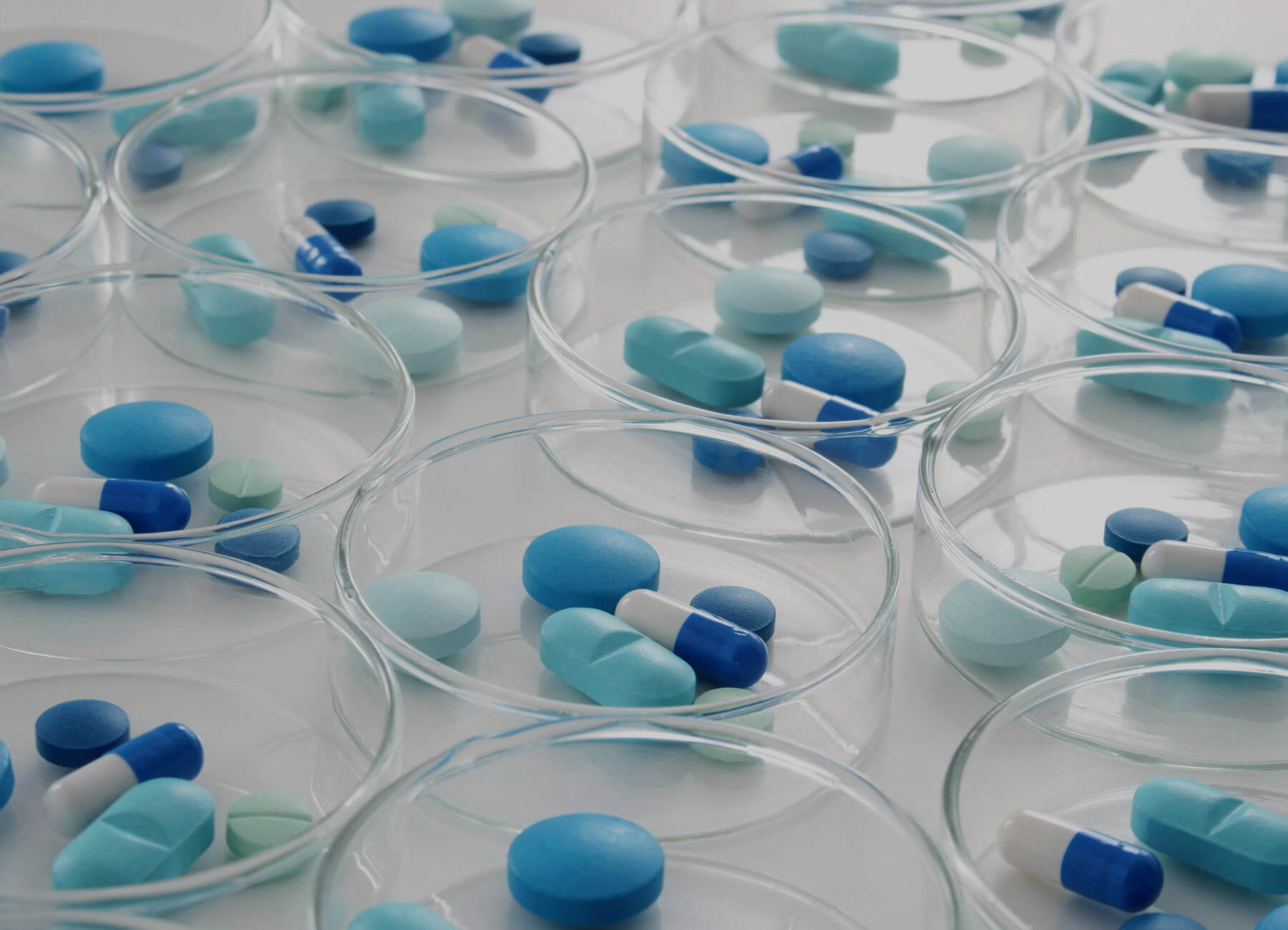 blue tablets sitting in small dishes