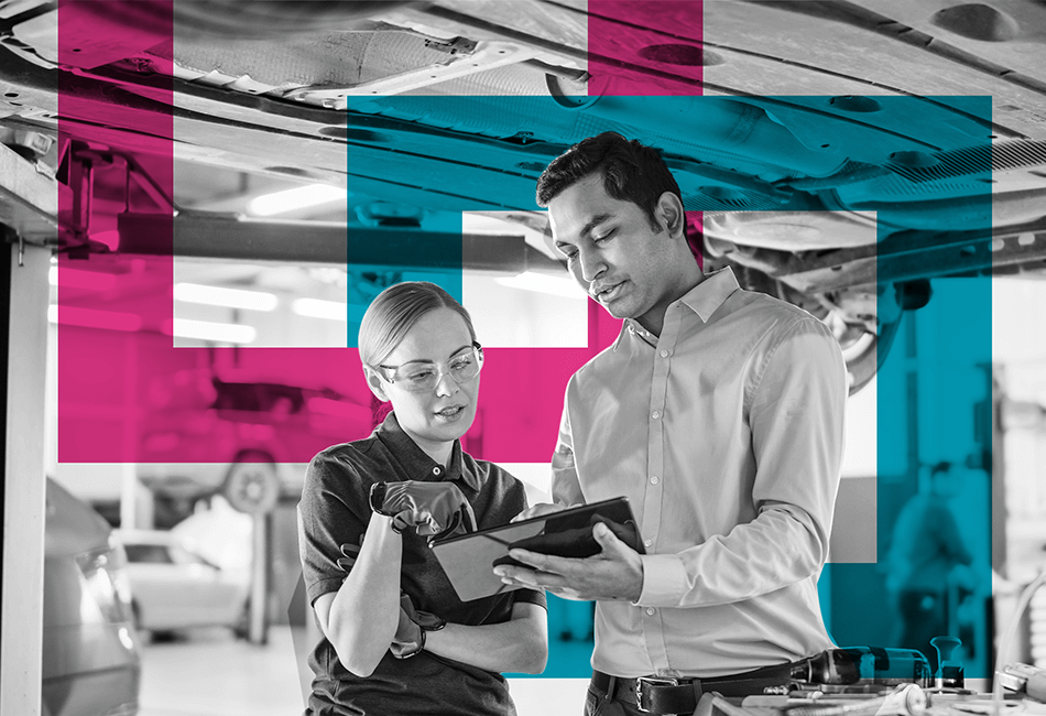 Two people looking at a tablet mid-conversation 